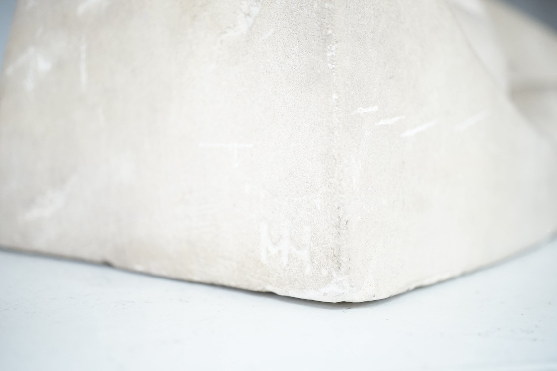 A stone carving of a sleeping nude woman, monogrammed MH, 37cm wide. Condition - fair